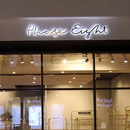 Side & rear halo illuminated letters. Brass on the front face